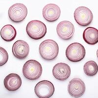 red onion slices. pattern texture background. isolated on white background photo