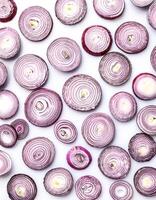red onion slices. pattern texture background. isolated on white background photo