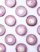 red onion slices. pattern texture background. isolated on white background photo