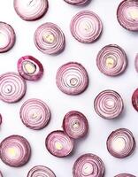 red onion slices. pattern texture background. isolated on white background photo