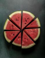 Overhead view of Fresh Ripe watermelon with cut sliced halves food summer background photo