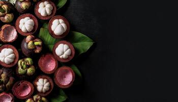 Overhead view of Fresh, Pile, Ripe and juicy sweet mangosteen fruits. Halves food summer background photo