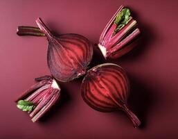Overhead view of Fresh, Ripe and juicy Red beetroot and beetroot cross sectoin. Halves food summer background photo
