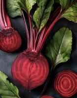 Overhead view of Fresh, Ripe and juicy Red beetroot and beetroot cross sectoin. Halves food summer background photo