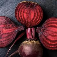 Overhead view of Fresh, Ripe and juicy Red beetroot and beetroot cross sectoin. Halves food summer background photo