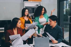 Stress, business people and employee frustrated with multitasking, pressure or overworked by team in chaos with paperwork. Anxiety, headache and worker overwhelmed by group and burnout in crisis photo
