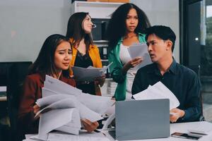 Stress, business people and employee frustrated with multitasking, pressure or overworked by team in chaos with paperwork. Anxiety, headache and worker overwhelmed by group and burnout in crisis photo