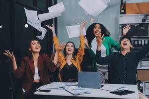 Motivated funny diverse business team people dancing celebrating success at corporate party on friday, happy friendly multiracial coworkers group having fun together enjoy victory dance in office photo
