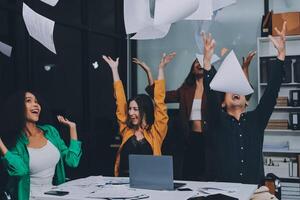 Motivated funny diverse business team people dancing celebrating success at corporate party on friday, happy friendly multiracial coworkers group having fun together enjoy victory dance in office photo