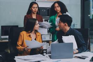 Stress, business people and employee frustrated with multitasking, pressure or overworked by team in chaos with paperwork. Anxiety, headache and worker overwhelmed by group and burnout in crisis photo