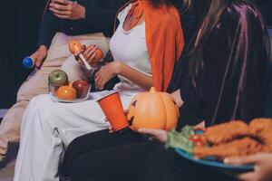 Joyful office Halloween party with coworkers in costumes, celebrating with drinks and laughter, fostering teamwork and festive spirit photo