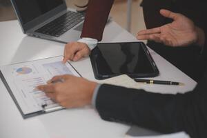 Audit concept,Administrator business man financial inspector and secretary making report calculating balance. Internal Revenue Service checking document. photo