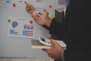Audit concept,Administrator business man financial inspector and secretary making report calculating balance. Internal Revenue Service checking document. photo