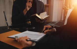 Law theme, gavel or mallet of the judge, lawyer enforcement officers, evidence-based cases taken into account in the court abount business, legislation. photo