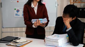 Audit concept,Administrator business man financial inspector and secretary making report calculating balance. Internal Revenue Service checking document. photo