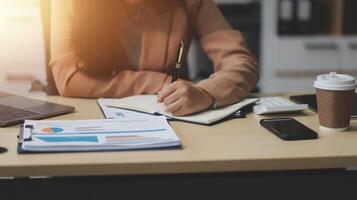 business documents businessman check legal document review Prepare documents or analysis reports, tax items, accounting documents, data contracts, office partner agreements. photo
