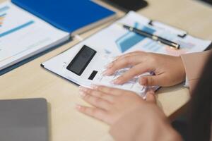 business documents businessman check legal document review Prepare documents or analysis reports, tax items, accounting documents, data contracts, office partner agreements. photo