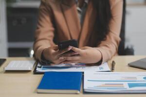 business documents businessman check legal document review Prepare documents or analysis reports, tax items, accounting documents, data contracts, office partner agreements. photo