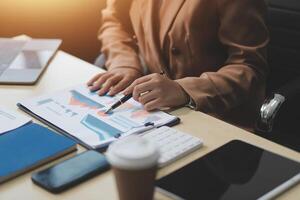business documents businessman check legal document review Prepare documents or analysis reports, tax items, accounting documents, data contracts, office partner agreements. photo