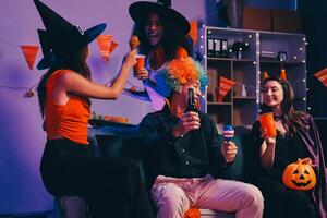 Joyful office Halloween party with coworkers in costumes, celebrating with drinks and laughter, fostering teamwork and festive spirit photo