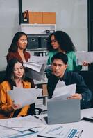 Stress, business people and employee frustrated with multitasking, pressure or overworked by team in chaos with paperwork. Anxiety, headache and worker overwhelmed by group and burnout in crisis photo