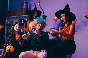 Joyful office Halloween party with coworkers in costumes, celebrating with drinks and laughter, fostering teamwork and festive spirit photo