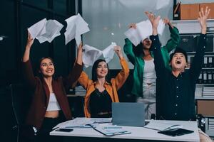Motivated funny diverse business team people dancing celebrating success at corporate party on friday, happy friendly multiracial coworkers group having fun together enjoy victory dance in office photo