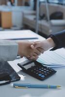 Business handshake for teamwork of business merger and acquisition,successful negotiate,hand shake,two businessman shake hand with partner to celebration partnership and business deal concept photo