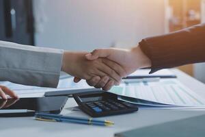 Business handshake for teamwork of business merger and acquisition,successful negotiate,hand shake,two businessman shake hand with partner to celebration partnership and business deal concept photo