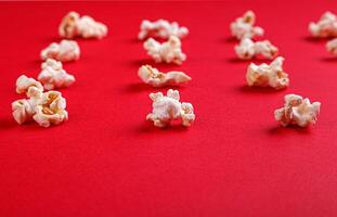 popcorn macro on a red background photo
