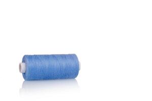 a skein of threads of blue color macro on a white background close up photo