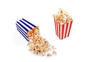 Glass with popcorn on a white background photo
