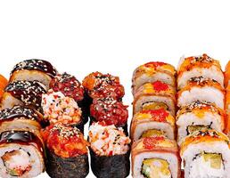 Large set of various sushi and rolls is lying on a white background photo