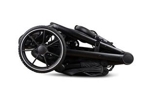 Modern black baby stroller folded and lying on white background photo