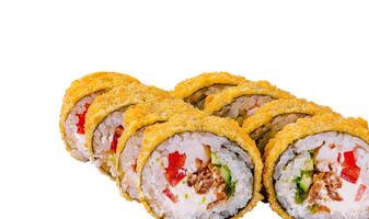 Tempura sushi rolls showing filling on white background photo