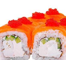 Philadelphia sushi roll topped with salmon and red caviar photo