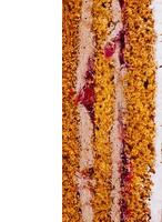 Delicious layered cake with chocolate and cherry filling showing texture photo
