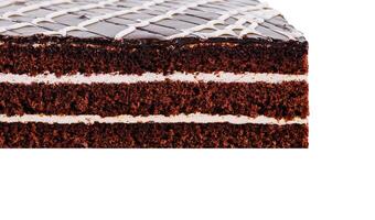 Delicious chocolate cake with white icing showing layers on white background photo
