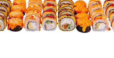 Delicious sushi rolls with different fillings are lying on a white background photo