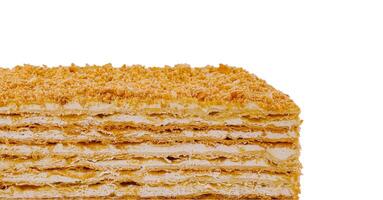Delicious multi layered napoleon cake with crumb topping isolated on white background photo