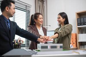 Real Estate Agents Collaborate on Marketing Strategies in Modern Office Setting photo