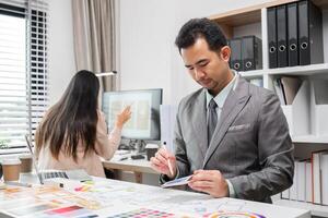 System Development Team Collaborating on UX UI Design in Modern Office Environment photo
