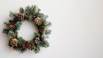 Evergreen Christmas Wreath with Pine Cones on a White Background photo