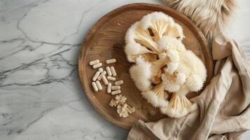 Exotic Mushrooms and Supplements on Wooden Plate photo