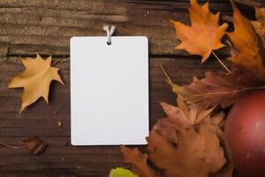 Autumn Leaves Background with Blank White Card for Text photo