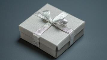 Elegant Silver Gift Box with Bow on White Background photo