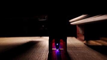 The process of laser wood cutting. A laser machine precisely carves lines on the surface, creating detailed and accurate designs. Perfect for themes of high-tech and manufacturing photo