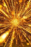 vibrant explosion of golden particles erupts from the center, scattering in all directions with shimmering brilliance. The glowing edges create a striking, energetic atmosphere. photo