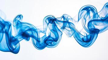 Delicate blue smoke tendrils rise gently, swirling and fading gracefully into lighter shades, evoking a sense of calm and tranquility in their fluid motion. photo