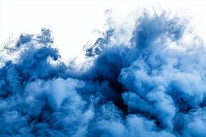 Thick blue smoke billows upwards with soft, expanding edges, displaying dark and light tones that form an enchanting, ethereal texture on a pristine white surface. photo